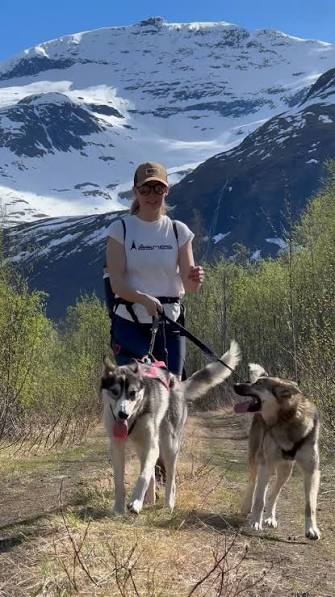 Hiker and dog on a mountain trail